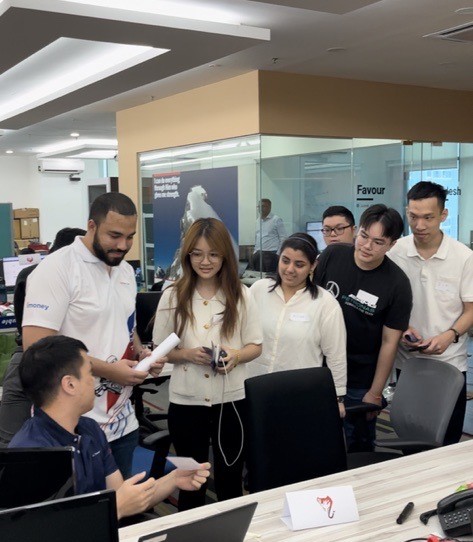 Students from Monash University Malaysia actively interacting with JurisTech's experts during the office tour