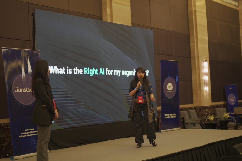 (Left) May Tang, JurisTech’s Presales Consultant, and (Right) Wai Hun, Co-Founder and CEO of JurisTech, taking the stage to share about the capabilities of AI in the financial industry at the GenAI Innovation Nexus in Indonesia