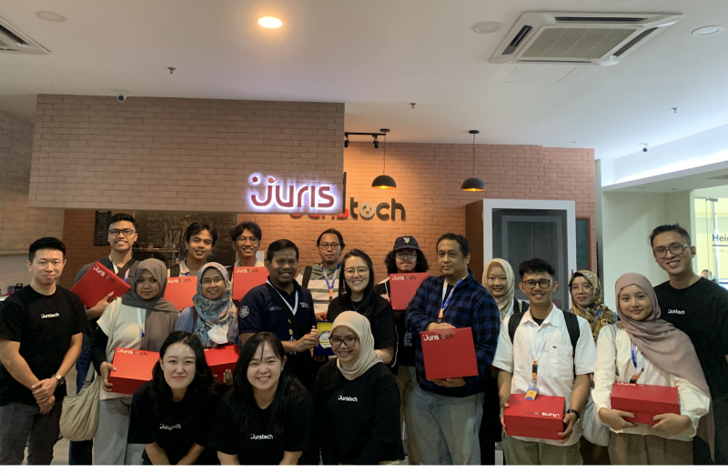 A group photo of representatives from JurisTech and Universitas Gadjah Mada